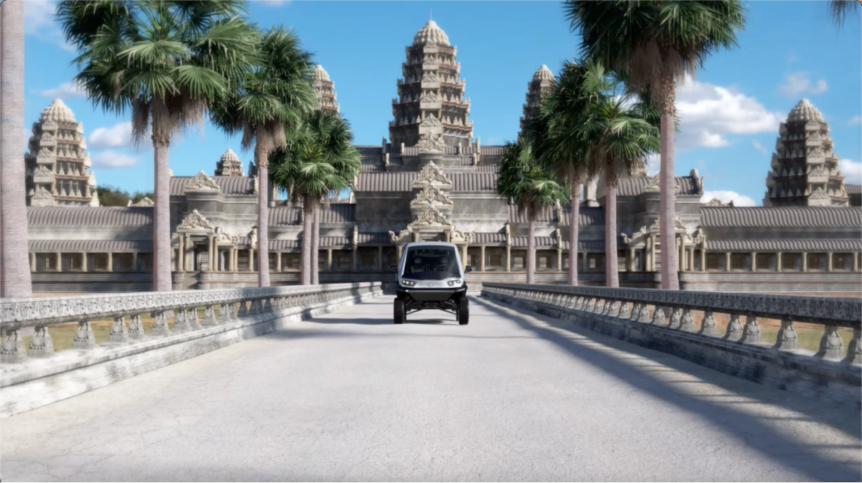 Novae low-speed electric vehicle driving through an Asian historical site.